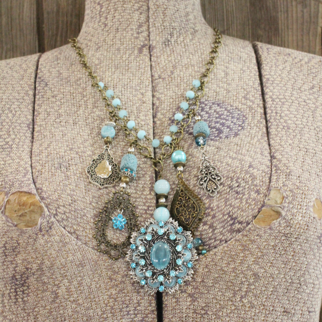 Embellishments Of Bronze & Silver Charming Blue Pendant Layered Necklace