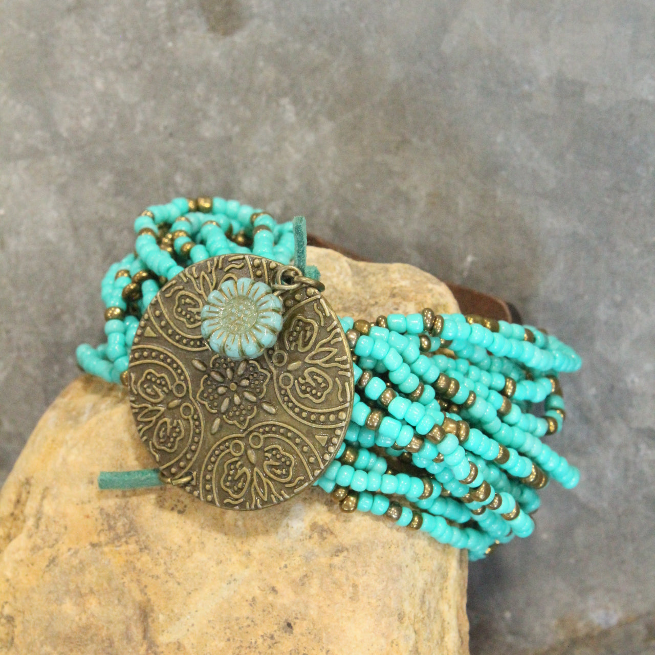 Glass Beaded Aqua Stretch & Buckle Bracelet With Czech Flower & Bronze Medallion Adornment