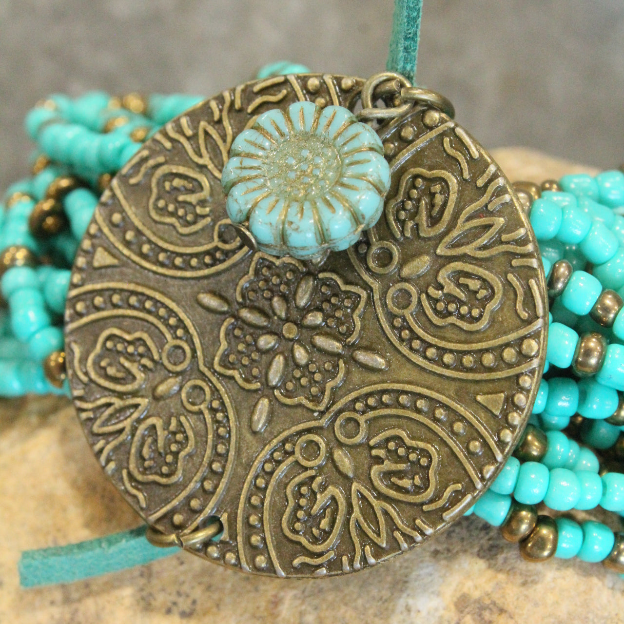 Glass Beaded Aqua Stretch & Buckle Bracelet With Czech Flower & Bronze Medallion Adornment